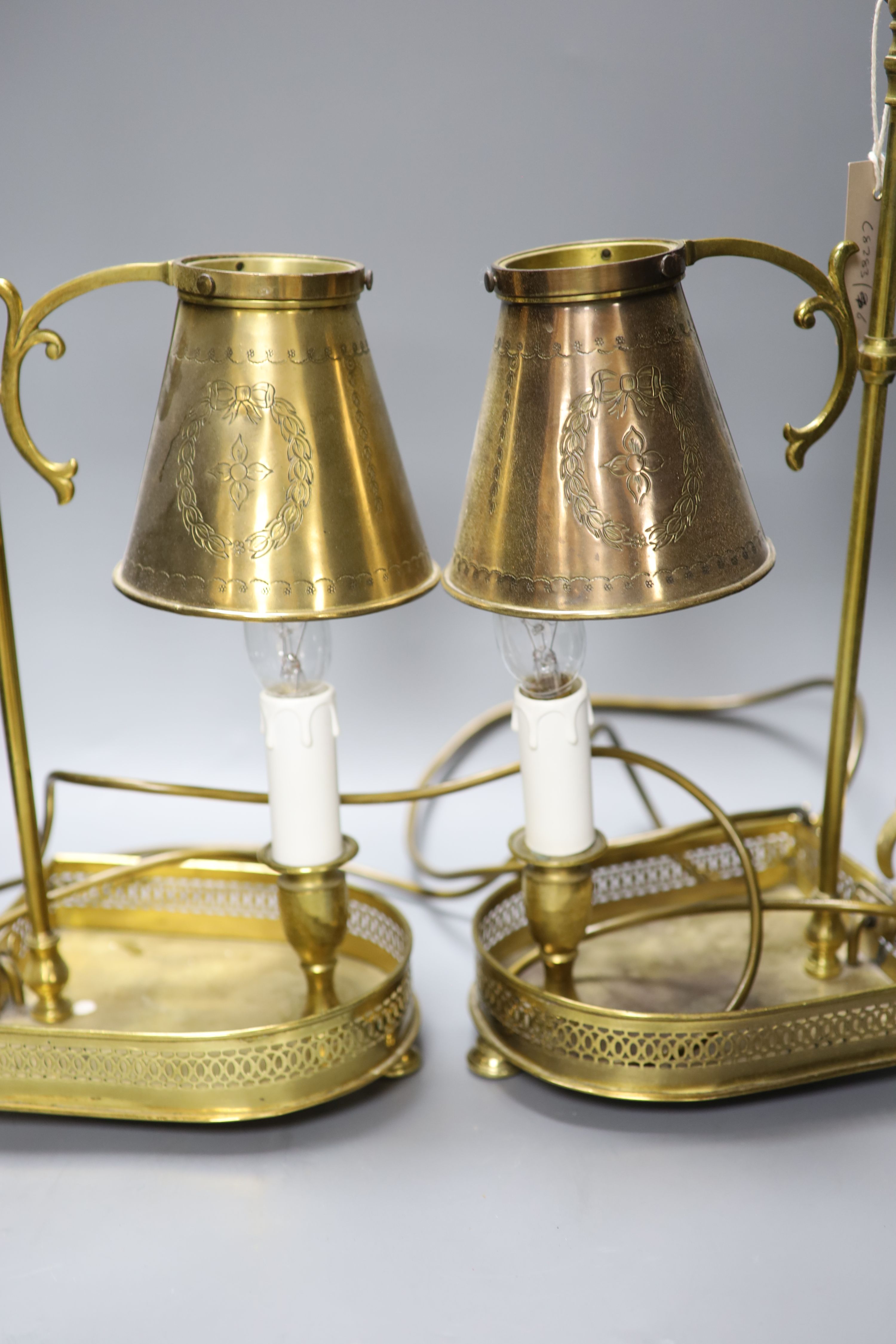 A pair of gilt metal Bouillotte lamps, with adjustable shades, height 47cm